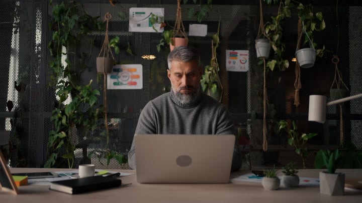 Focused Businessman Engaged In Creative Office Environment