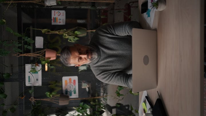 Focused Businessman Engages in Creative Office Environment