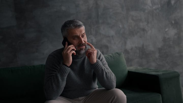 Executive Man Engages in Deep Conversation on Phone