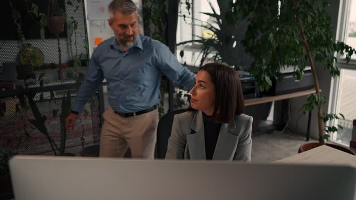 Businesswoman Engages in Thoughtful Dialogue at Her Desk