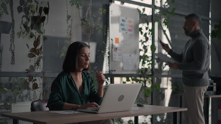 Focused Businesswoman Engaging in Productive Office Work