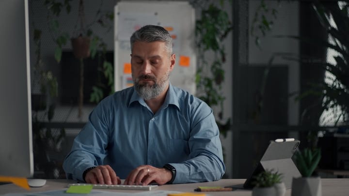 Focused Businessman Working in a Contemporary Office Space