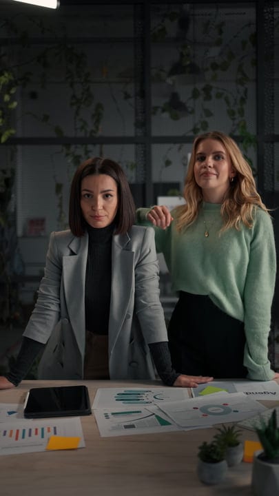 Confident Businesswomen Collaborate On Strategic Planning