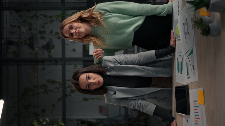 Collaborative Minds Analyzing Data In A Modern Office