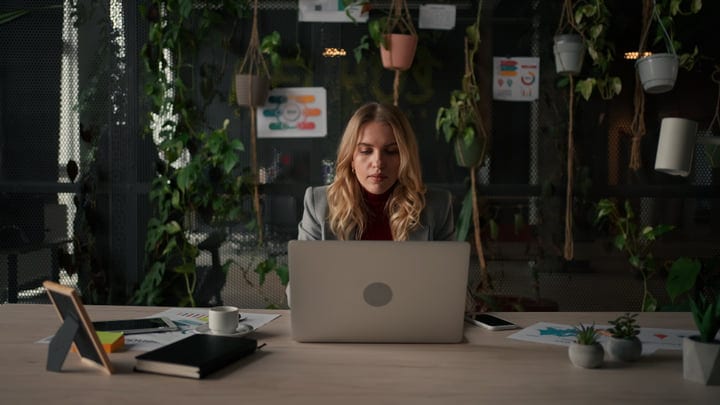 Focused Businesswoman Navigates Her Ambitious Office Day