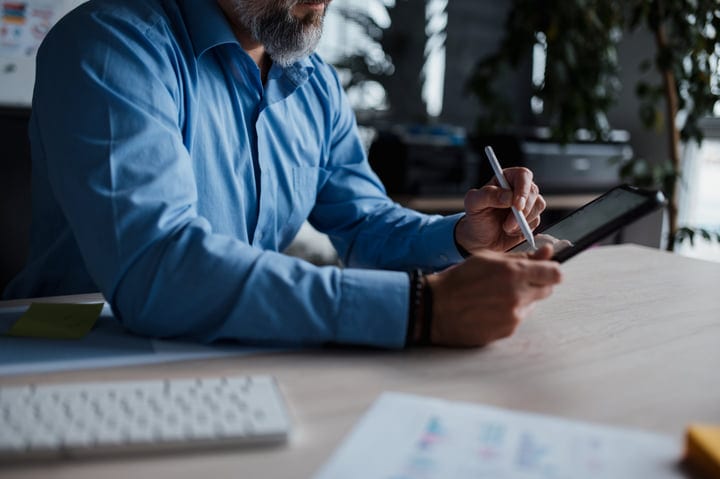 Focused Professional Uses Tablet For Creative Brainstorming