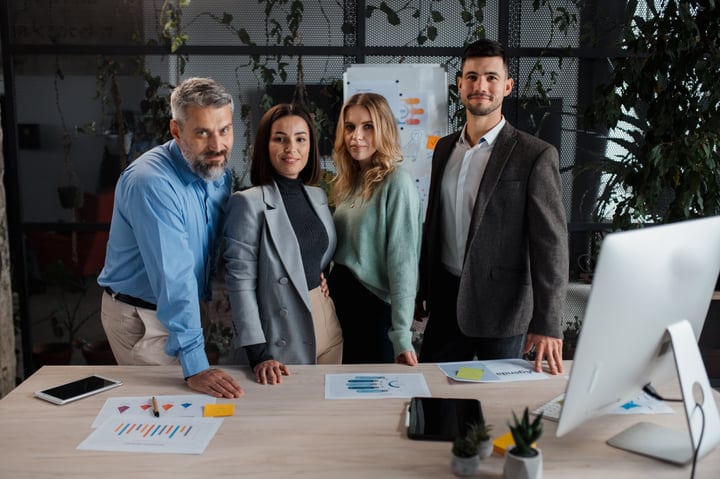 Diverse Team Collaborates Around Office Table