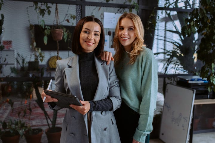 Confident Businesswomen Collaborate in Modern Office Space