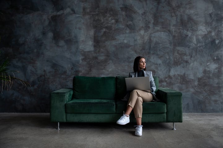 Contemplative Businesswoman Reflects in a Modern Workspace