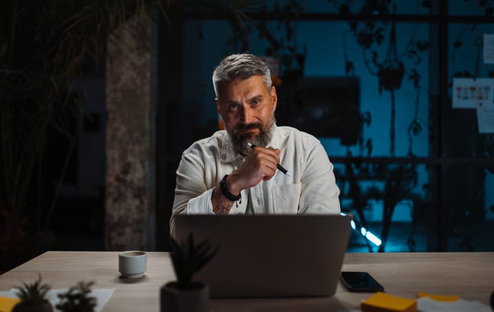 Focused Businessman Pondering Strategies In A Modern Office
