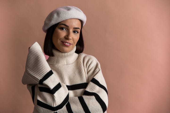 Confident Businesswoman Embracing Cozy Winter Office Style