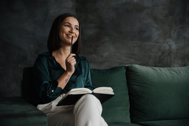 Thoughtful Businesswoman Ponders Ideas On A Cozy Sofa