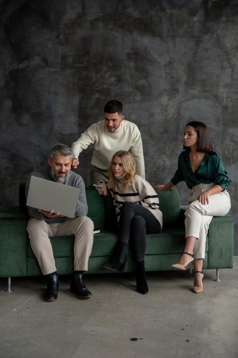 Team Collaborating Enthusiastically in Contemporary Office Setting
