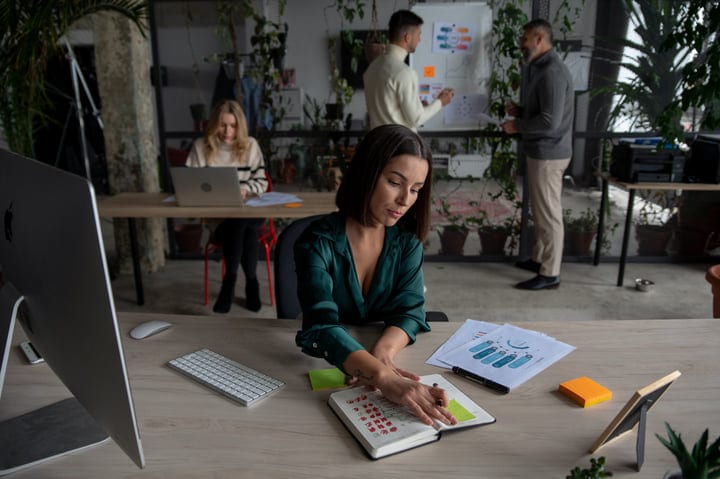 Focused Businesswoman Planning Her Day In Modern Office