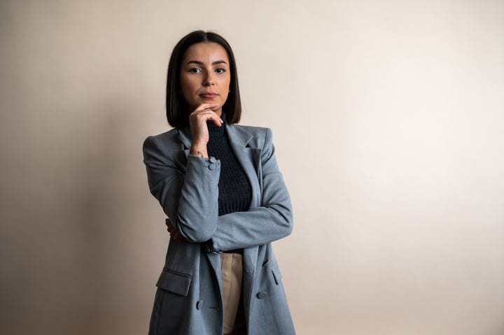Confident Professional Woman Contemplates Future Success