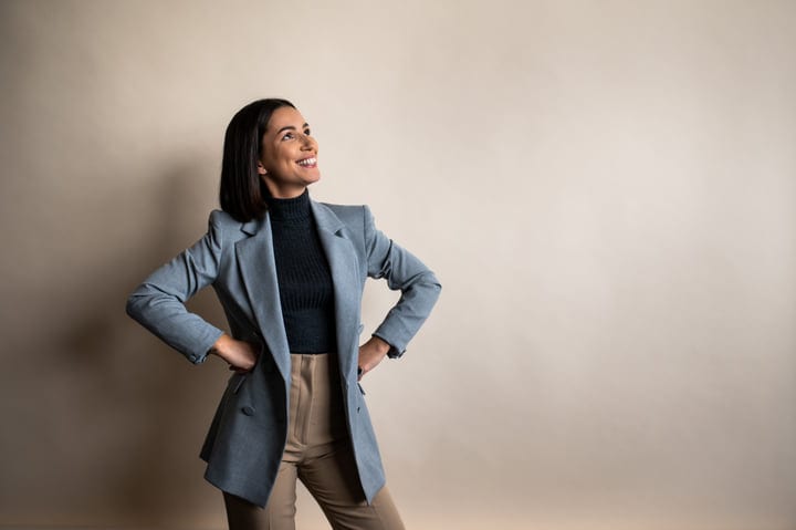 Confident Businesswoman Embraces Her Success In The Office