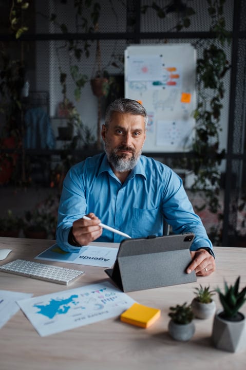 Focused Professional Engages with Digital Presentation Tools