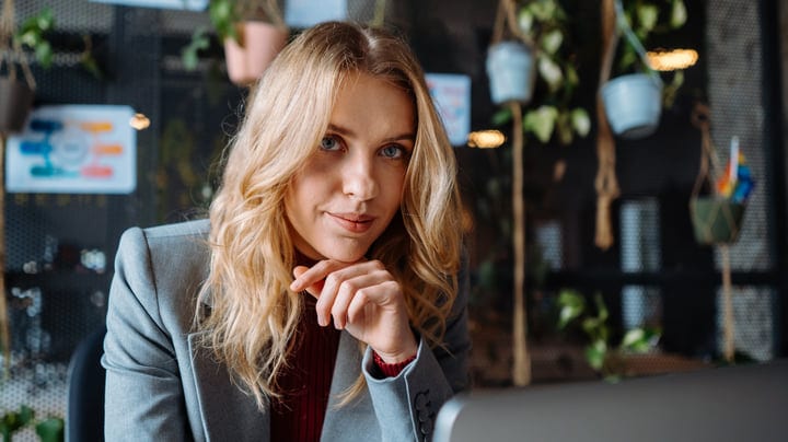 Focused Businesswoman Engages in Creative Office Environment