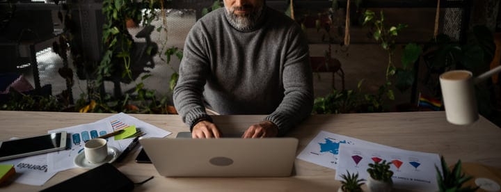 Focused Professional Typing in a Green Office Space