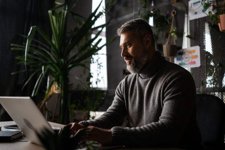 Focused Professional Engages in Thoughtful Office Work