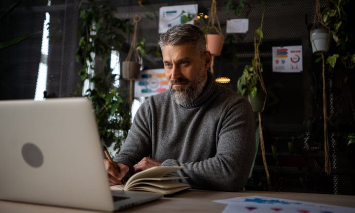 Focused Professional Writing Notes in Cozy Office Setting