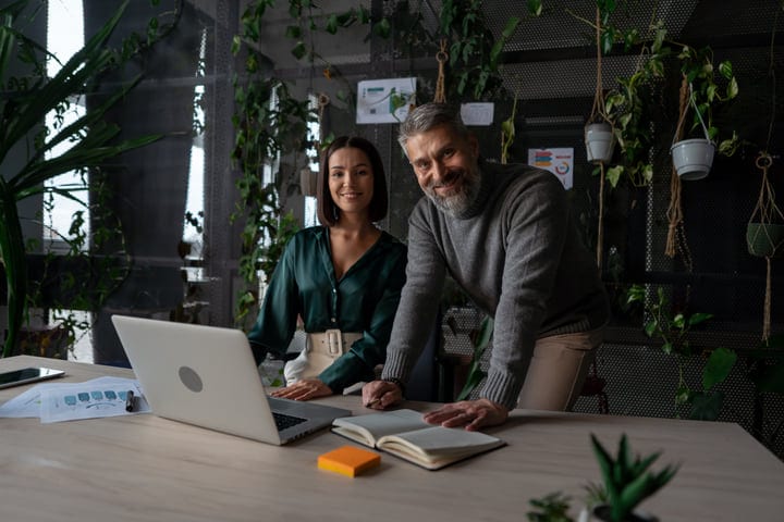 Colleagues Collaborate in a Green Office Environment
