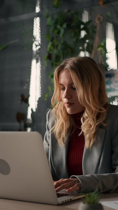 Focused Entrepreneur Navigating Digital Tasks In Modern Office