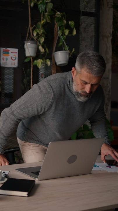 Modern Professional Balances Tasks In A Green Workspace