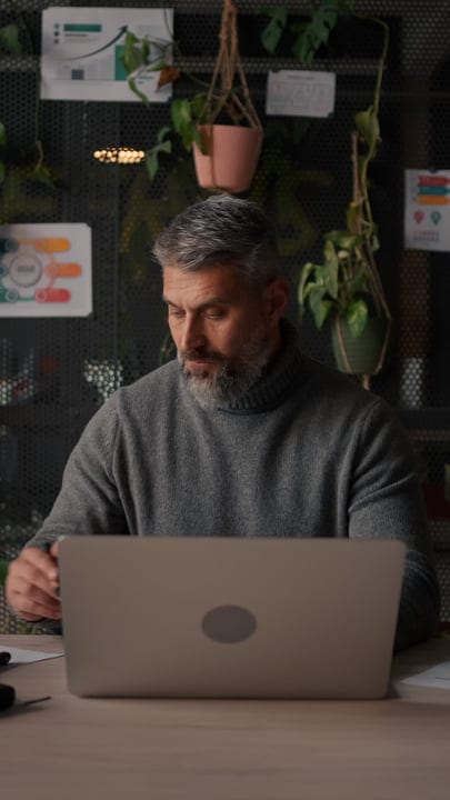Contemplative Businessman Engaged In Thoughtful Office Work