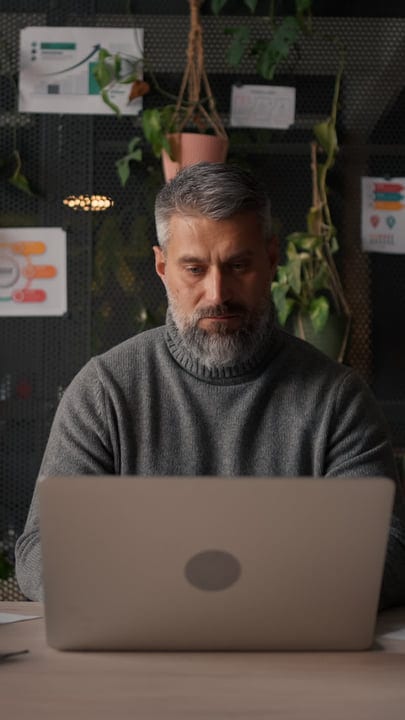 Focused Businessman Engages With His Work In Modern Office