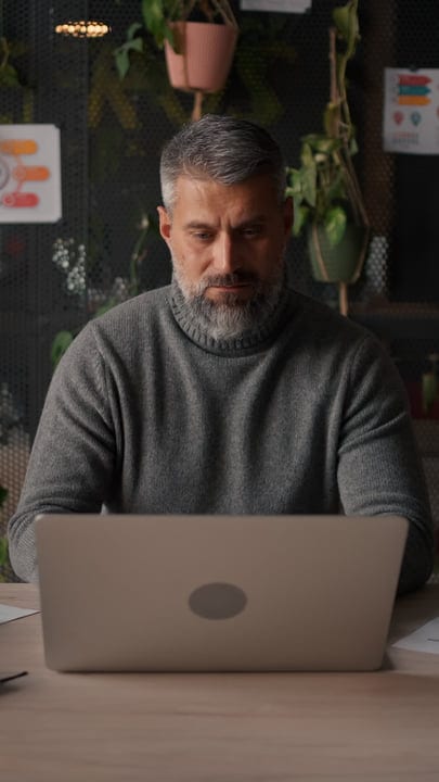 Focused Businessman Engaged With Work In Modern Office