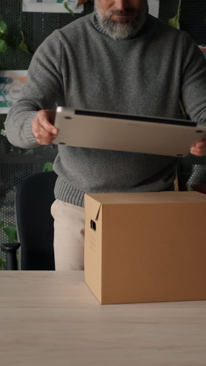 Businessman Packs Up Office For A New Beginning