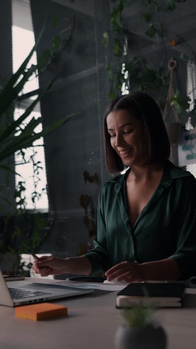 Focused Businesswoman Engages in Creative Office Planning