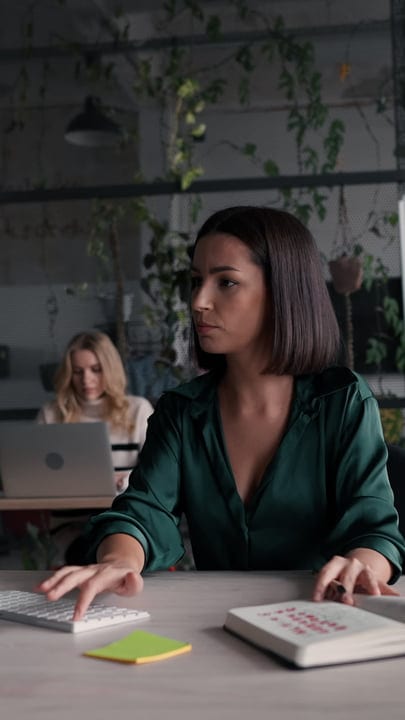 Focused Businesswoman Strategizes Her Day In Modern Office
