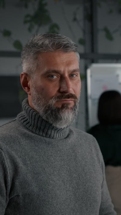 Confident Businessman In Thoughtful Office Setting