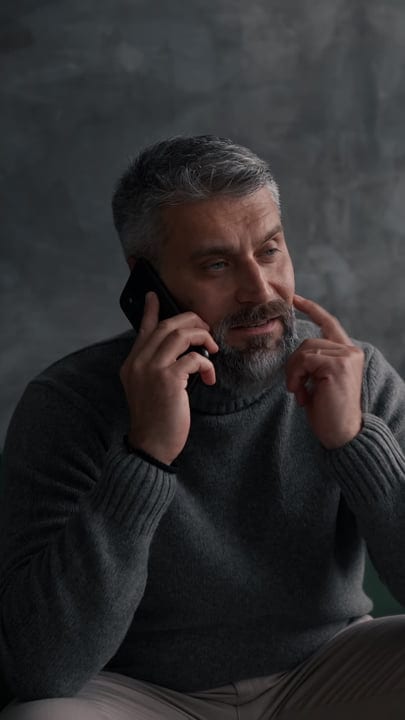 Confident Businessman Engaging In A Productive Phone Call
