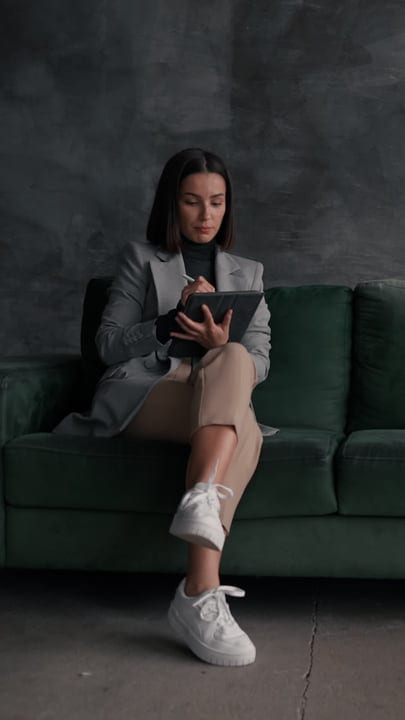 Focused Businesswoman Engages with Tablet in Contemporary Office
