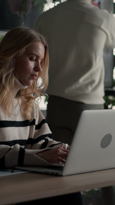 Focused Businesswoman Embraces Productivity in Modern Office