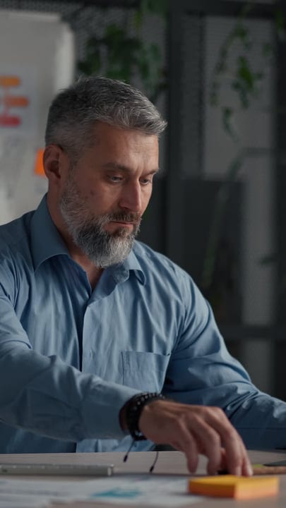Focused Professional Strategizing In A Modern Office Space