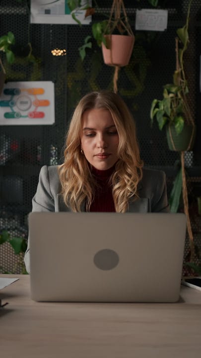 Focused Businesswoman Engages In Productive Office Workspace