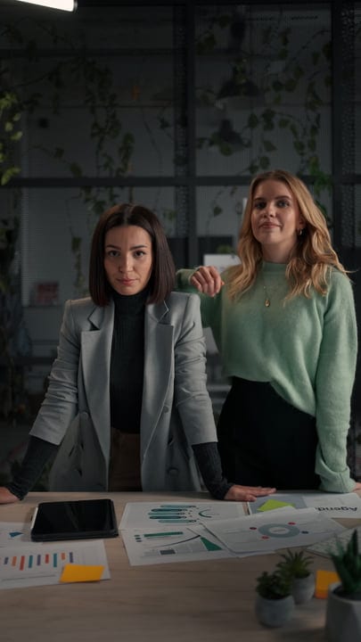 Confident Businesswomen Collaborating In Modern Office Space