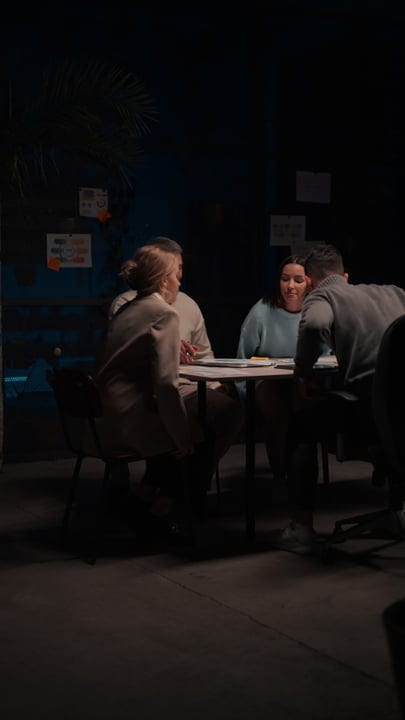 Collaborative Team Engages in Strategic Office Discussion