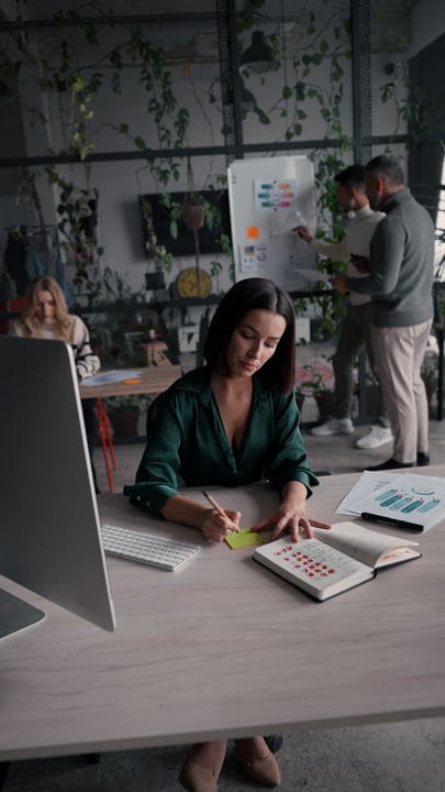 Focused Businesswoman Planning Her Day In Stylish Office