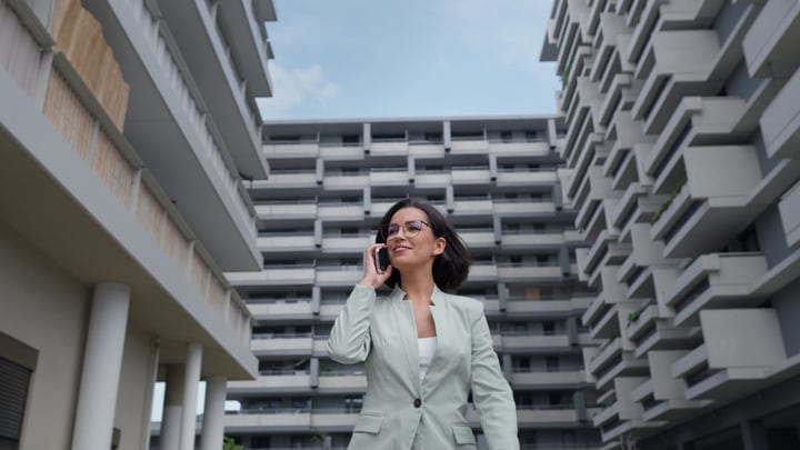 Confident Businesswoman Navigates Vienna's Modern Architecture