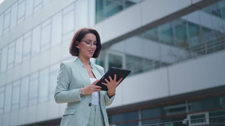 Confident Businesswoman Navigates The Digital World Outdoors