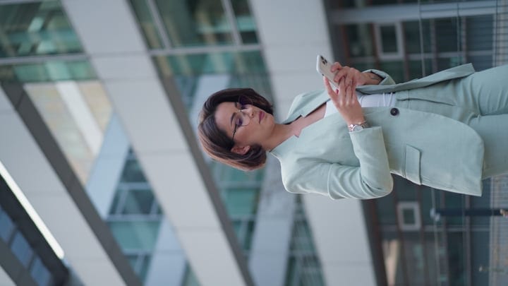 Confident Businesswoman Navigates Vienna's Modern Architecture