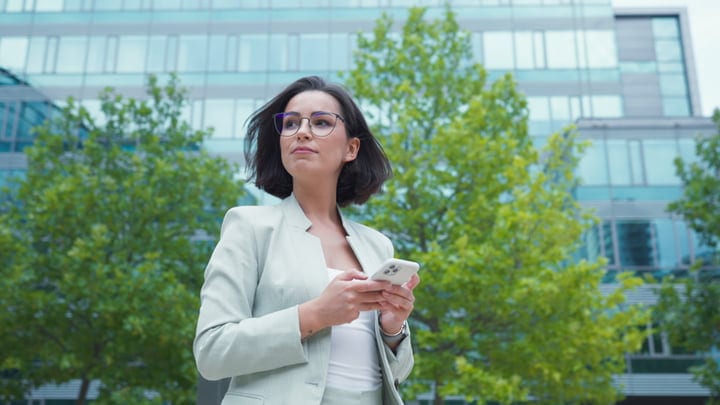 Confident Businesswoman Navigates Vienna's Urban Landscape