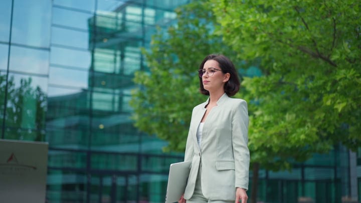 Confident Businesswoman Strolling Through Vienna's Modern District
