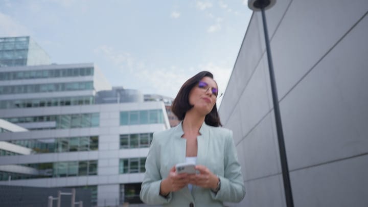 Confident Businesswoman Navigates Vienna's Modern Streets