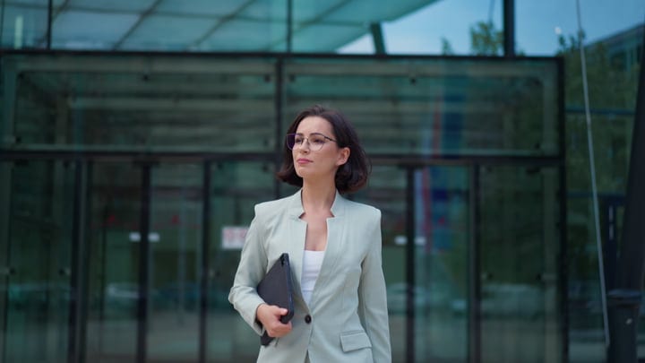 Confident Businesswoman Walking Through Vienna's Modern Streets